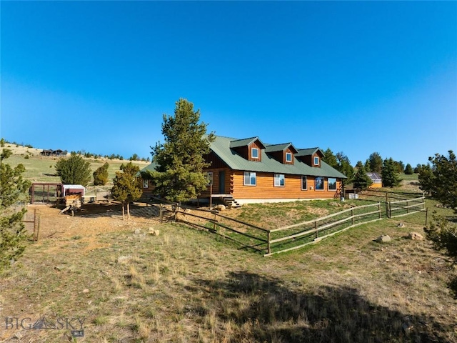 101 Deerfoot Trl, Ennis, MT 59729 - view of property exterior featuring log siding and a rural view