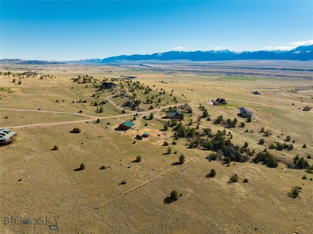 101 Deerfoot Trl, Ennis, MT 59729 - aerial view of property's location with a mountain backdrop, rural landscape, and a desert landscape
