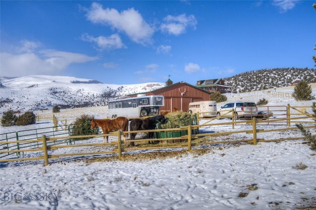 101 Deerfoot Trl, Ennis, MT 59729 - yard layered in snow with fence and a mountain view