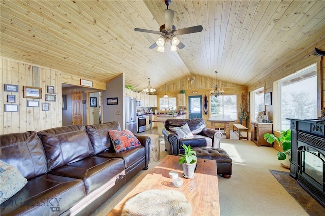 101 Deerfoot Trl, Ennis, MT 59729 - carpeted living area featuring wooden ceiling, wood walls, a wood stove, lofted ceiling, and a chandelier