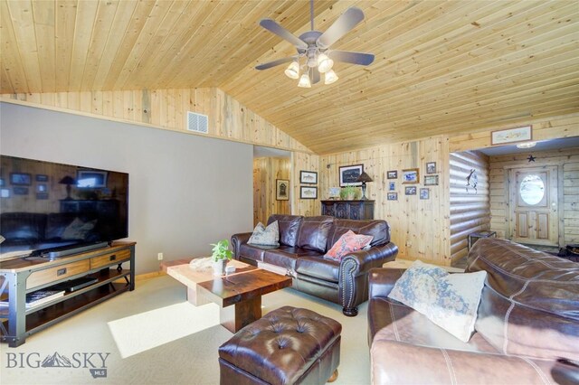 101 Deerfoot Trl, Ennis, MT 59729 - living room with vaulted ceiling, wood ceiling, a ceiling fan, wooden walls, and carpet flooring