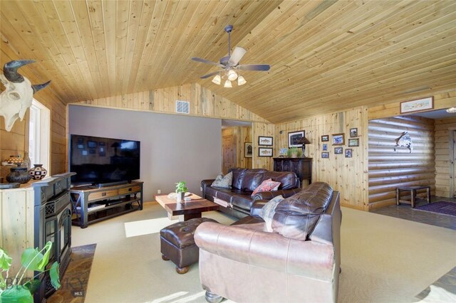 101 Deerfoot Trl, Ennis, MT 59729 - living area featuring a wood stove, wood ceiling, lofted ceiling, carpet, and wood walls