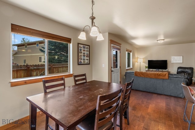 dining area featuring dark wood-style floors