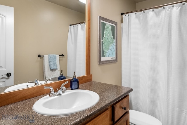 full bathroom with vanity, toilet, and a shower with shower curtain
