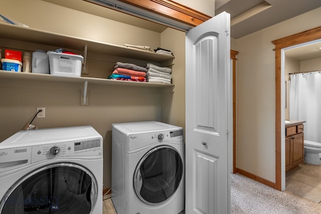 washroom with separate washer and dryer, baseboards, and light carpet
