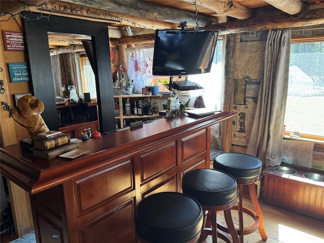 31 Basin Creek Rd, Boulder, MT 59631 - indoor dry bar featuring plenty of natural light, wood finished floors, and beamed ceiling