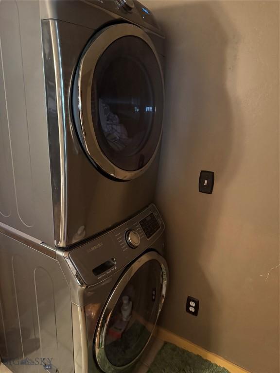 31 Basin Creek Rd, Boulder, MT 59631 - clothes washing area with stacked washer and clothes dryer and baseboards