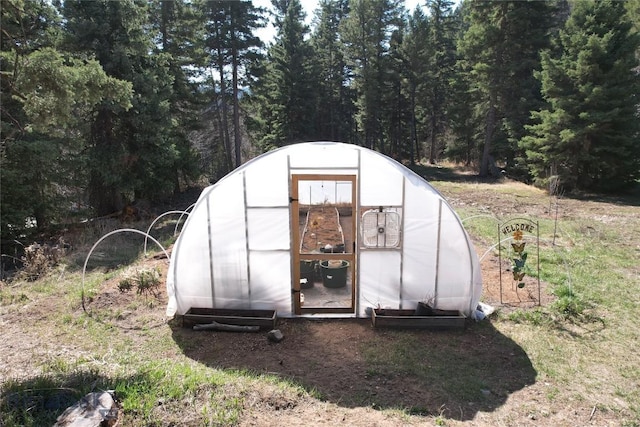 31 Basin Creek Rd, Boulder, MT 59631 - view of greenhouse featuring a forest view