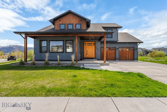 1650 Windrow, Bozeman, MT 59718 - view of front of house with driveway, a front lawn, a porch, board and batten siding, and a mountain view