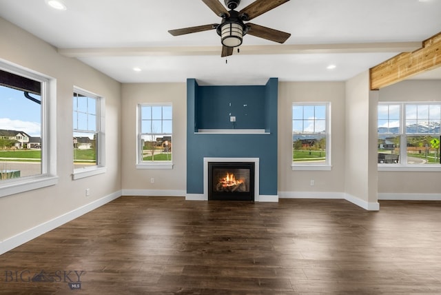 1650 Windrow, Bozeman, MT 59718 - unfurnished living room featuring plenty of natural light, beam ceiling, a large fireplace, dark wood finished floors, and ceiling fan