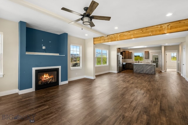 1650 Windrow, Bozeman, MT 59718 - unfurnished living room with recessed lighting, beamed ceiling, a fireplace, dark wood-style floors, and ceiling fan