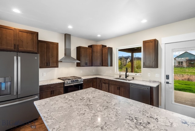 1650 Windrow, Bozeman, MT 59718 - kitchen featuring appliances with stainless steel finishes, wall chimney exhaust hood, a sink, light stone counters, and dark brown cabinets
