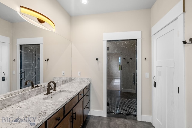 1650 Windrow, Bozeman, MT 59718 - full bathroom with baseboards, vanity, a shower stall, and tile patterned floors