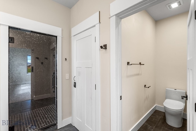 1650 Windrow, Bozeman, MT 59718 - bathroom featuring baseboards and toilet