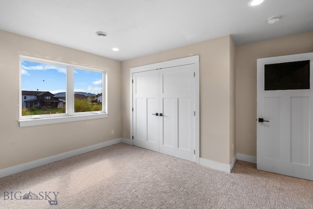 1650 Windrow, Bozeman, MT 59718 - unfurnished bedroom featuring carpet floors, baseboards, a closet, and recessed lighting