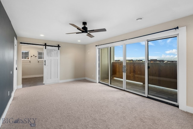 1650 Windrow, Bozeman, MT 59718 - spare room featuring ceiling fan, a barn door, baseboards, carpet, and recessed lighting