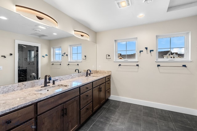 1650 Windrow, Bozeman, MT 59718 - full bath with baseboards, healthy amount of natural light, double vanity, a shower, and recessed lighting