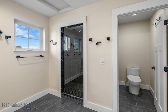 1650 Windrow, Bozeman, MT 59718 - full bathroom with tile patterned flooring, a stall shower, baseboards, and toilet