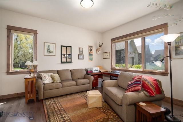 living area featuring hardwood / wood-style floors and baseboards