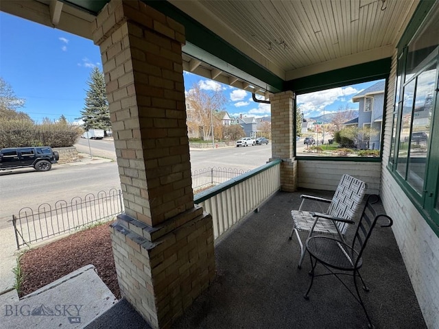 1100 Caledonia St, Butte, MT 59701 - view of patio with a porch and a residential view