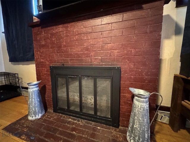 1100 Caledonia St, Butte, MT 59701 - detailed view of a brick fireplace and wood finished floors