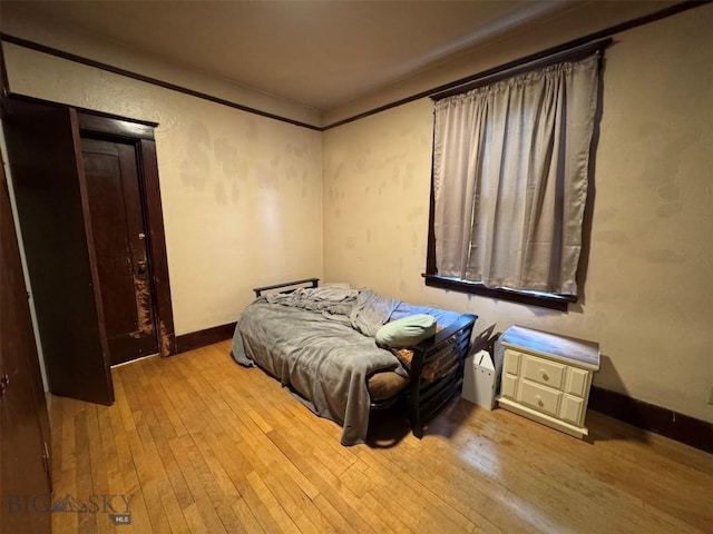 1100 Caledonia St, Butte, MT 59701 - bedroom with hardwood / wood-style flooring and baseboards