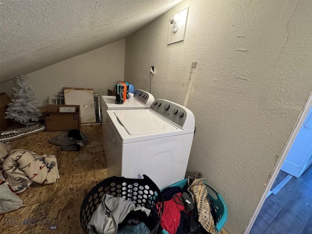 1100 Caledonia St, Butte, MT 59701 - clothes washing area featuring washing machine and dryer, a textured ceiling, and a textured wall