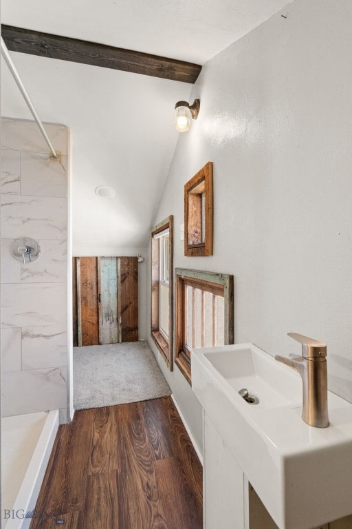 bathroom featuring a shower and wood finished floors