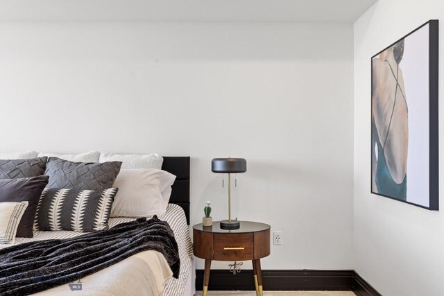 bedroom featuring baseboards