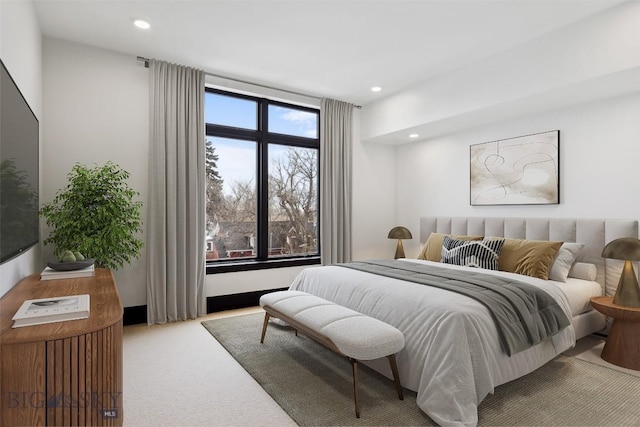 bedroom with carpet floors and recessed lighting