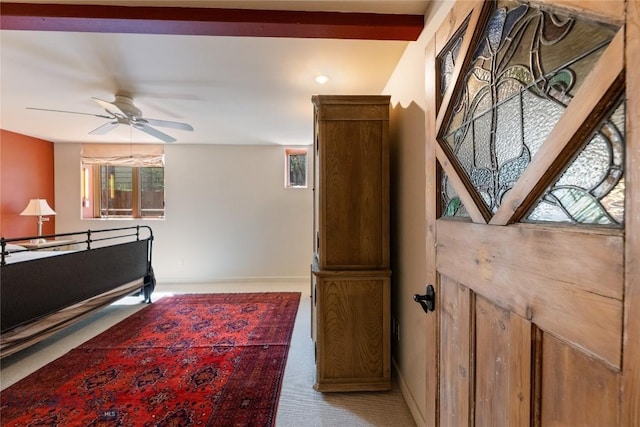 bedroom with light carpet and baseboards