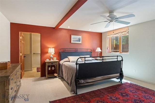 bedroom featuring light colored carpet, baseboards, and a ceiling fan