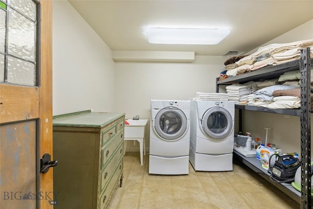laundry room featuring washing machine and clothes dryer