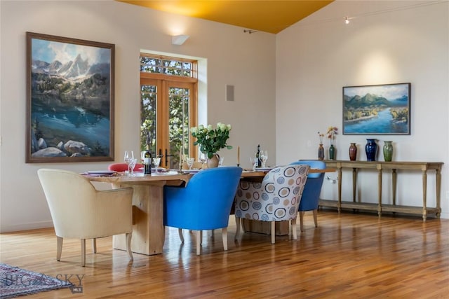 dining area featuring wood finished floors and baseboards