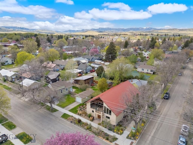 aerial view of residential area with mountains