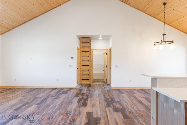 unfurnished living room featuring vaulted ceiling, wooden ceiling, wood finished floors, baseboards, and a chandelier