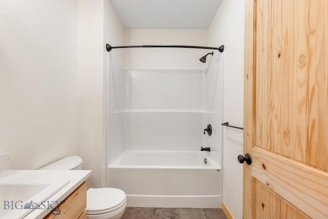 bathroom featuring toilet, vanity, bathtub / shower combination, and tile patterned floors