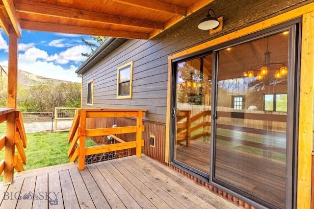 wooden terrace featuring a mountain view