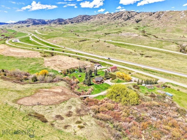 aerial view of sparsely populated area featuring a mountainous background
