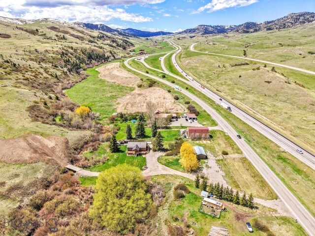 view of property location with a mountain backdrop and rural landscape