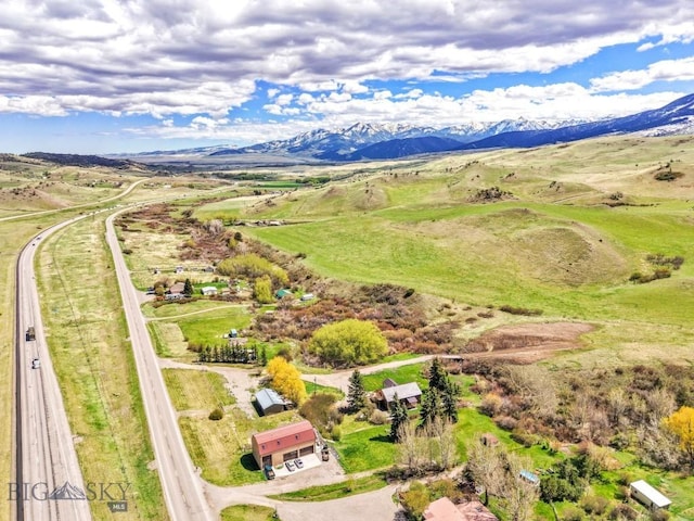 aerial view of sparsely populated area featuring a mountain backdrop