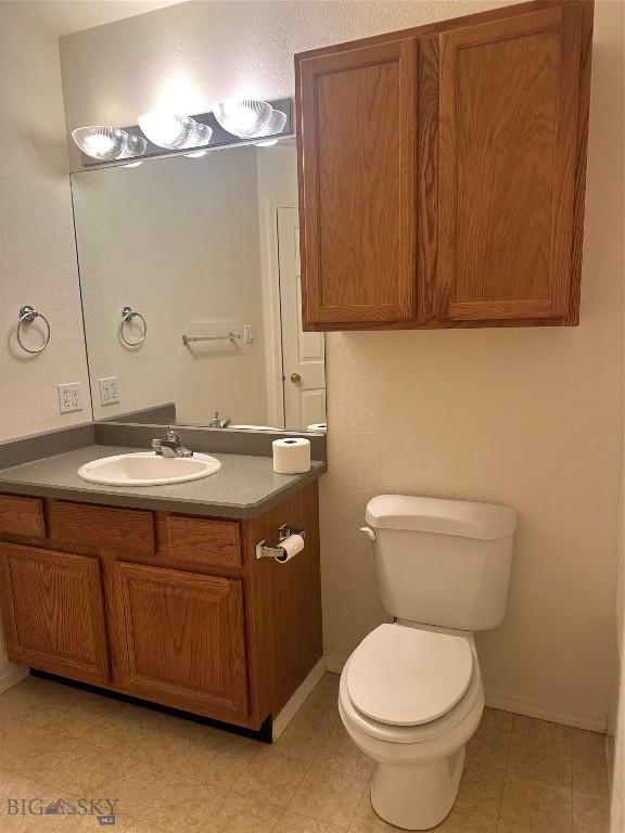 2921 Mammoth, Butte, MT 59701 - half bath featuring vanity, toilet, and baseboards