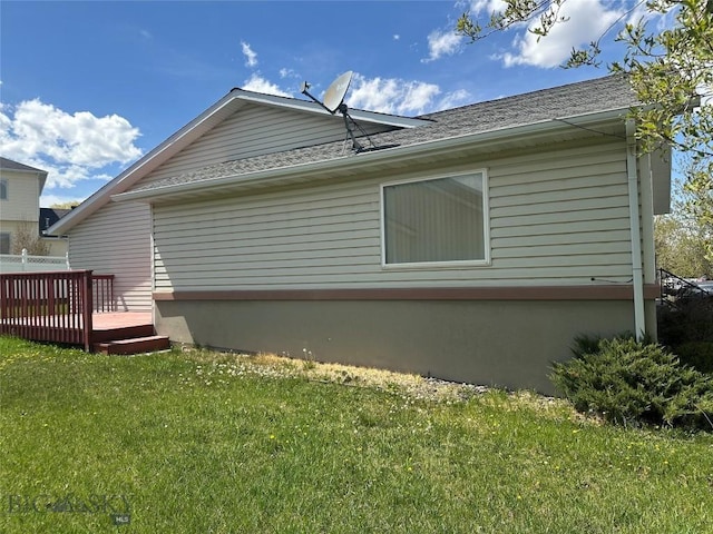 2921 Mammoth, Butte, MT 59701 - view of home's exterior with a lawn, a wooden deck, and a shingled roof