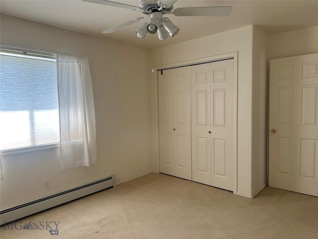 2921 Mammoth, Butte, MT 59701 - unfurnished bedroom featuring baseboard heating, light carpet, and multiple windows