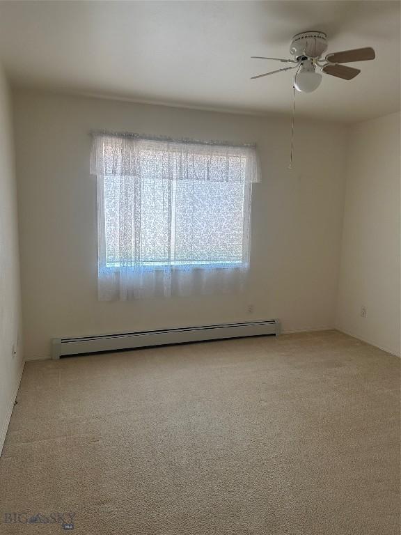 2921 Mammoth, Butte, MT 59701 - empty room with ceiling fan, carpet flooring, and a baseboard radiator