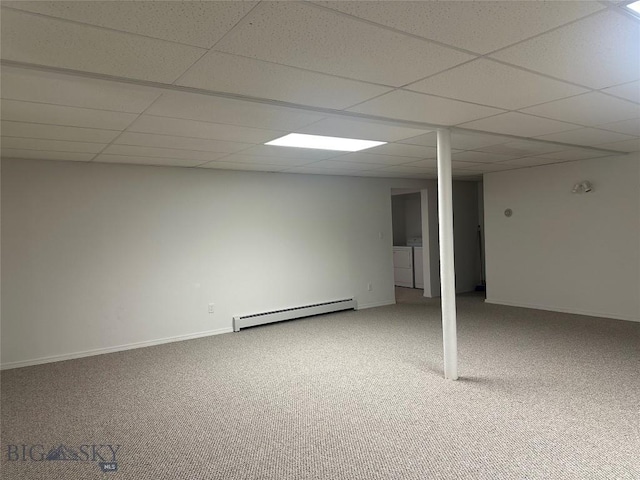 2921 Mammoth, Butte, MT 59701 - finished below grade area with a baseboard heating unit, washing machine and clothes dryer, carpet floors, a drop ceiling, and baseboards