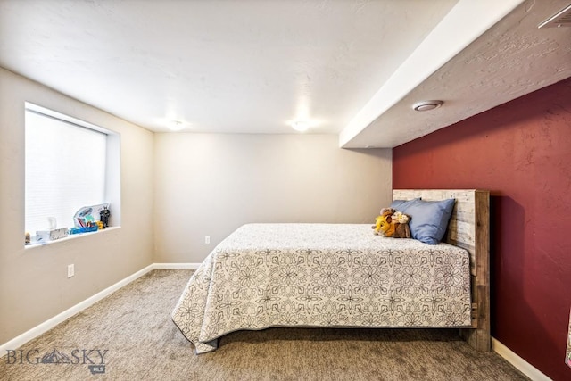carpeted bedroom with baseboards