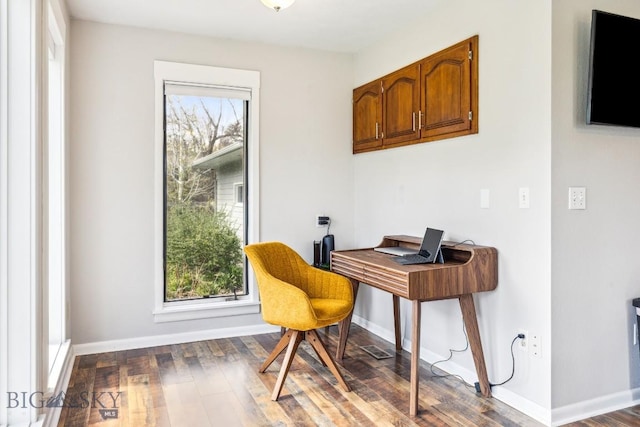 office with plenty of natural light, wood finished floors, and baseboards