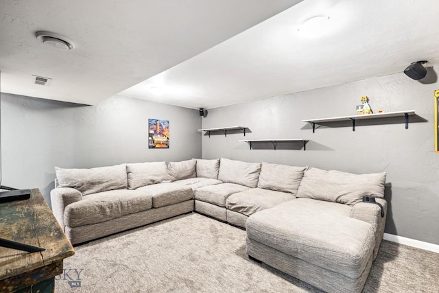 carpeted living area with baseboards
