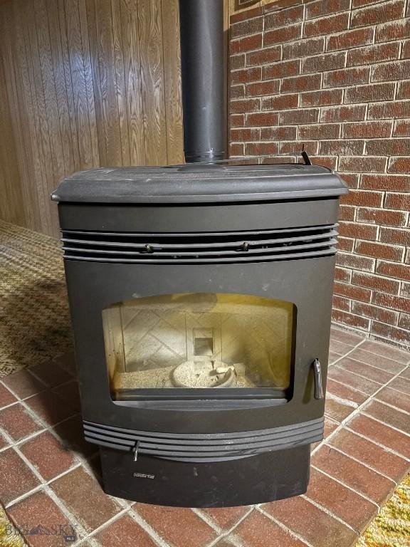 detailed view of a wood stove and brick wall